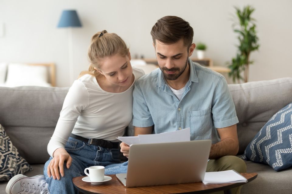 Young couple reviewing their finances
