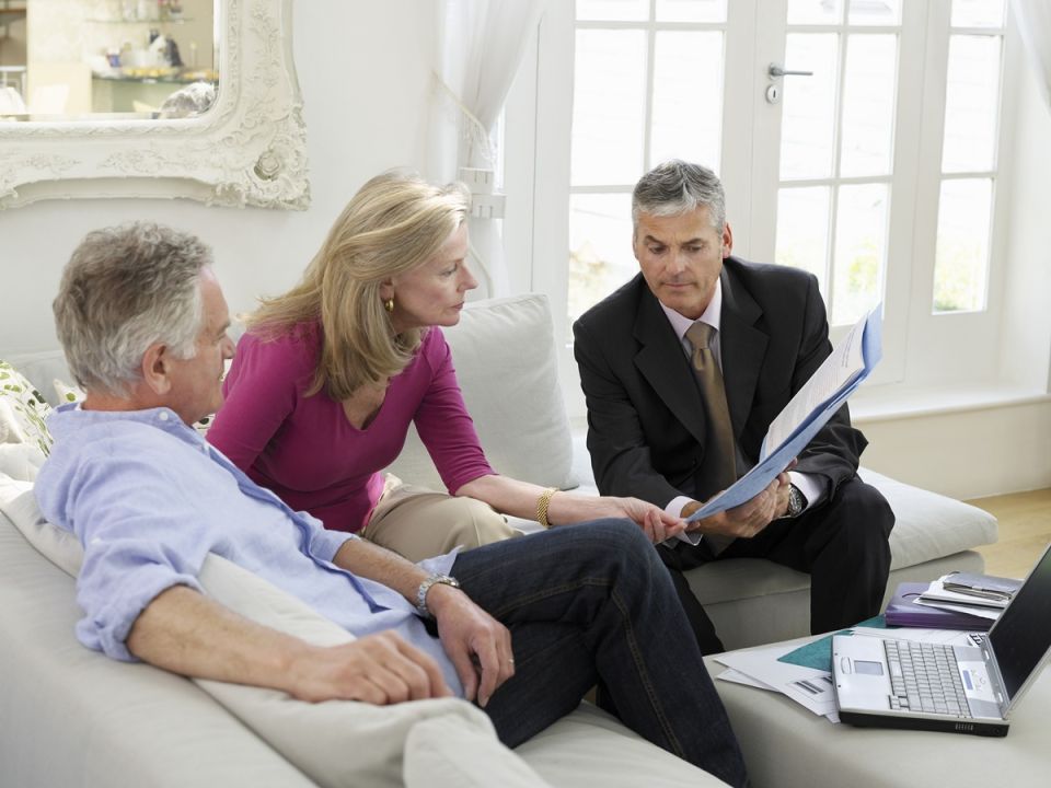 older couple with financial adviser
